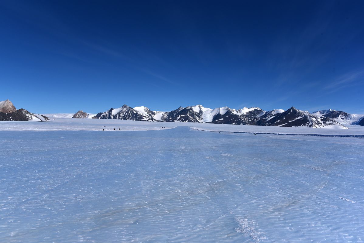 11A Looking Down The Hard Blue Ice Of Union Glacier Runway In Antarctica To Rhodes Bluff, Lester Peak On Edson Hills On The Way To Climb Mount Vinson